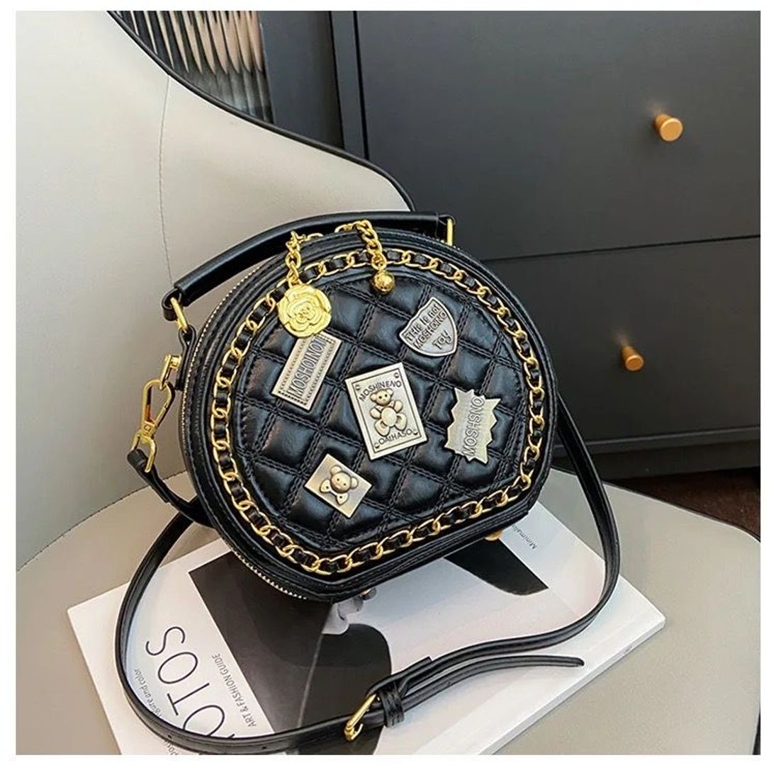 Bolso tipo Moschino redondo 