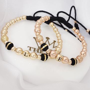 Imagen del producto Par manillas con balín inicial rosado y amarilla 