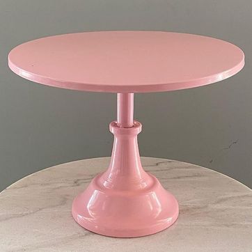 Imagen del producto Base para pasteles en metal rosa.