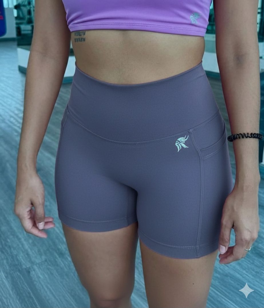 Short Hybrid ajustado con bolsillos laterales y sin costura delantera tiro alto Lycra