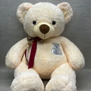 Imagen del producto OSO CON BORDADO Y MOÑO 60 CM