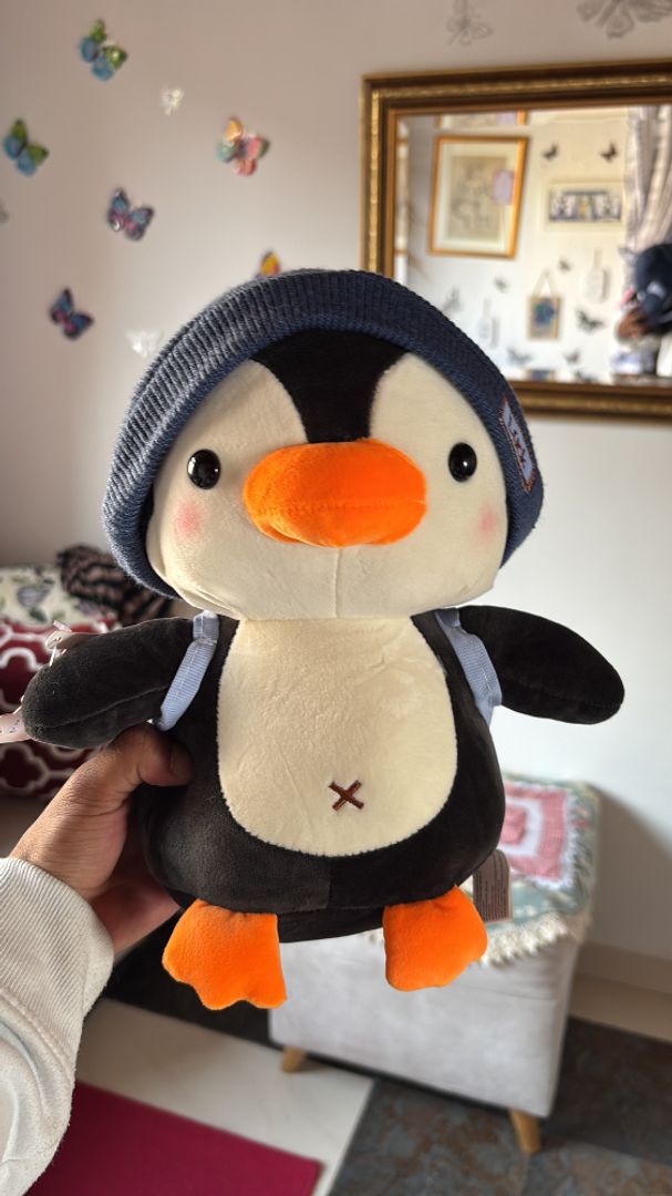 Pingüino con gorro azul