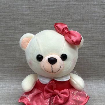 Imagen del producto Osita con vestido rosa y moño  de 21  cm 