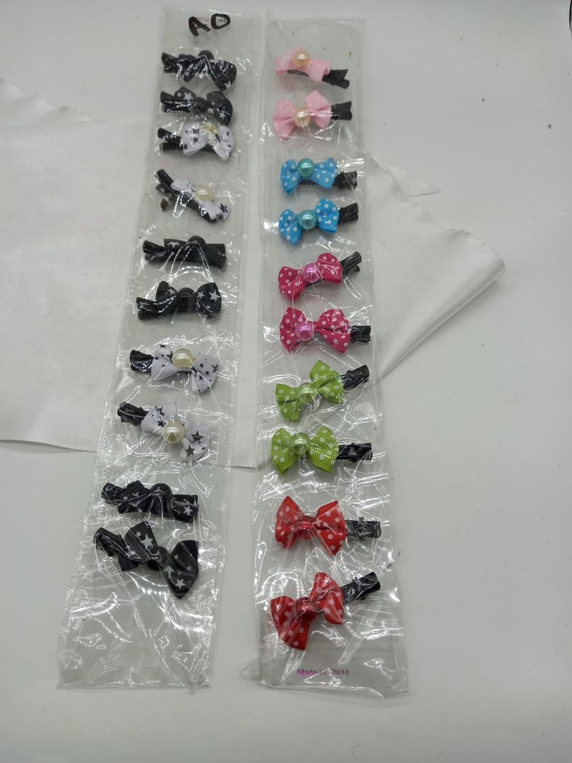 Tira de pinza pico loro con moño 