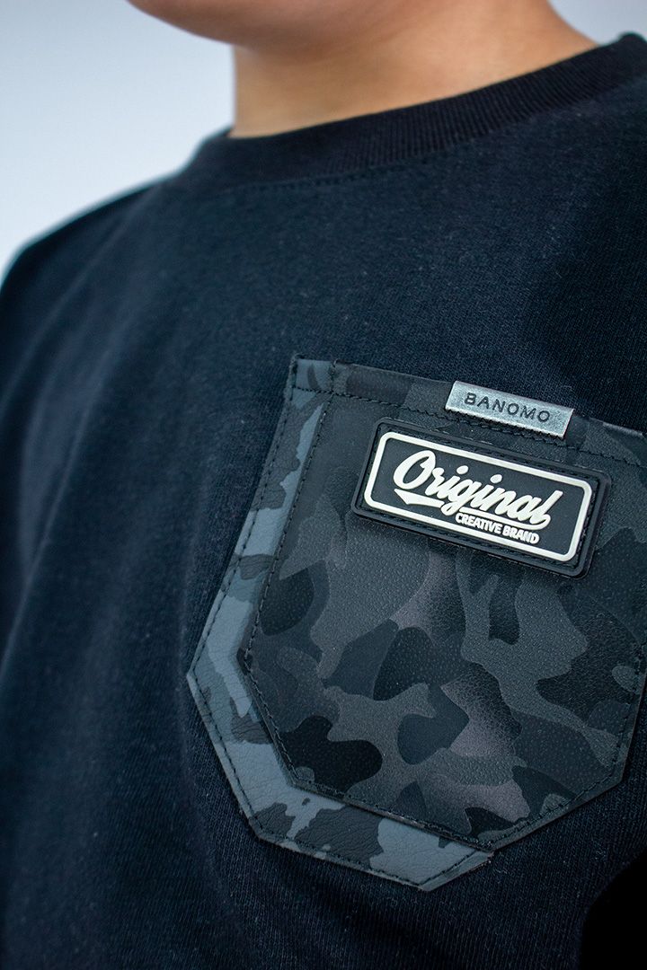 C. NIÑO OVER BOLSILLO MILITAR