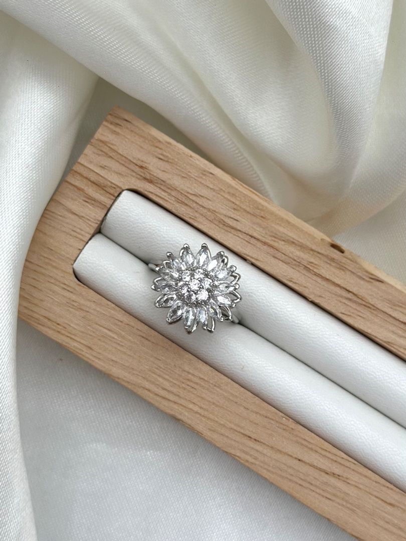 Anillo flor giratorio 