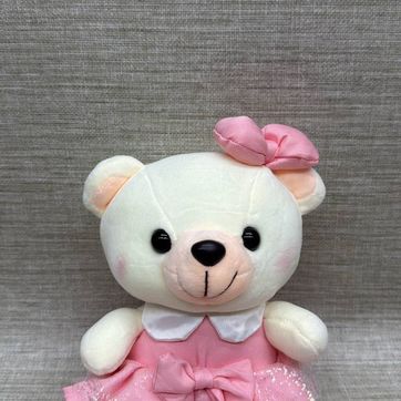 Imagen del producto Osita con vestido rosa y moño de 21 cm 