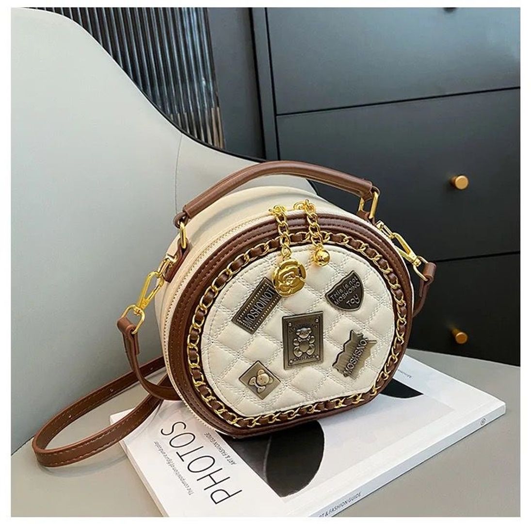 Bolso tipo Moschino redondo 