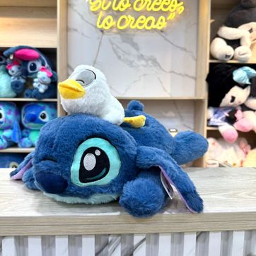 Imagen del producto PELUCHE STICH  CON PATO ACOSTADO 43cm.