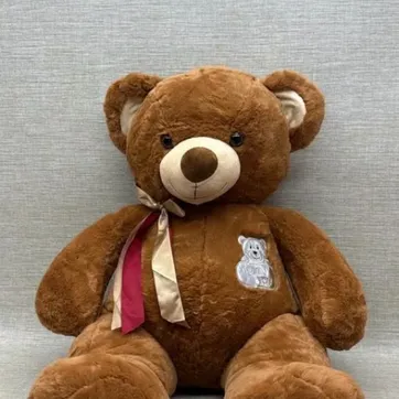 Imagen del producto OSO SURTIDO CON BORDADO Y MOÑO 60 CM