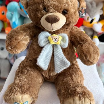 Imagen del producto Oso patas corta moño azul 45cm 