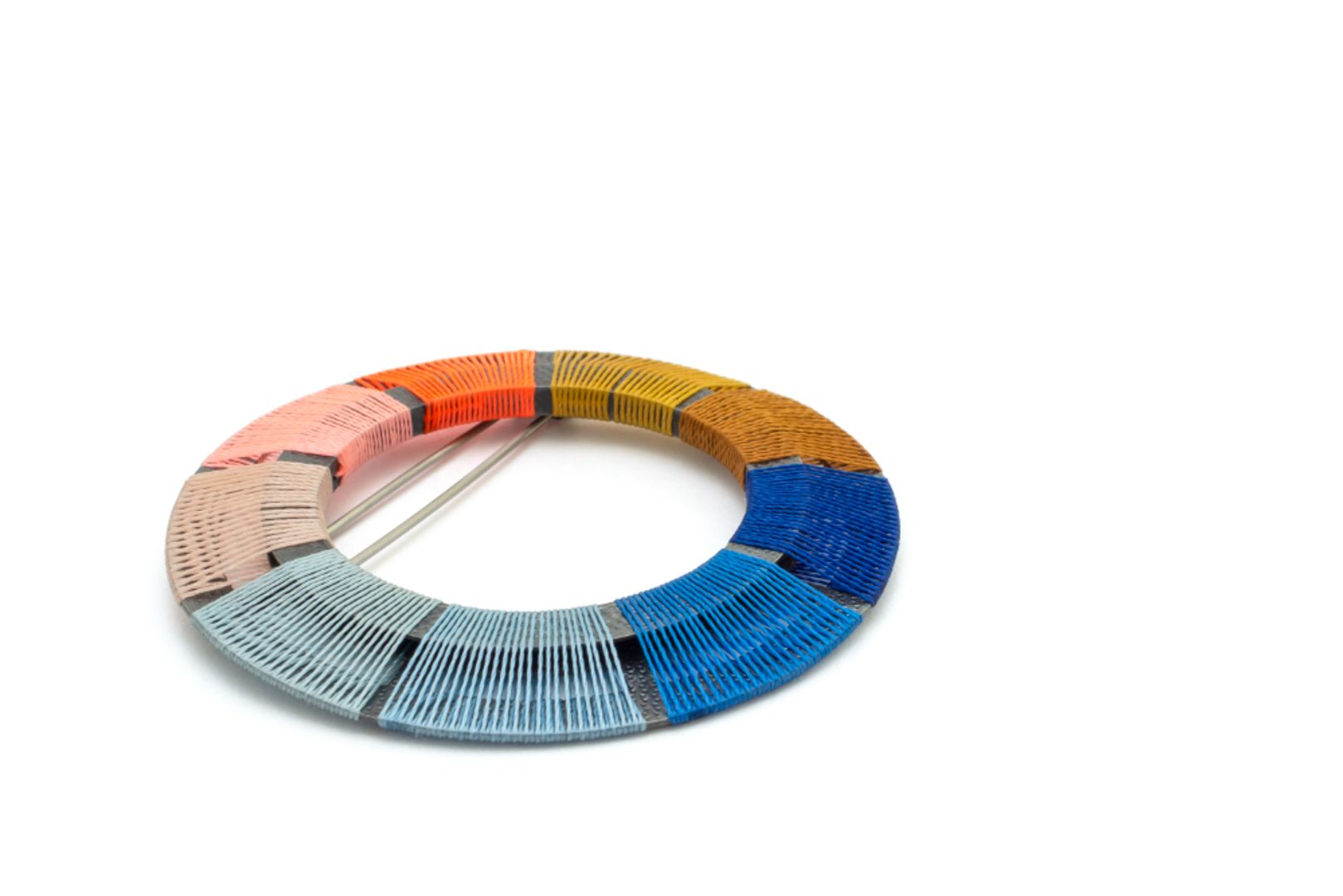 HAND WOVEN CIRCLE BROOCH