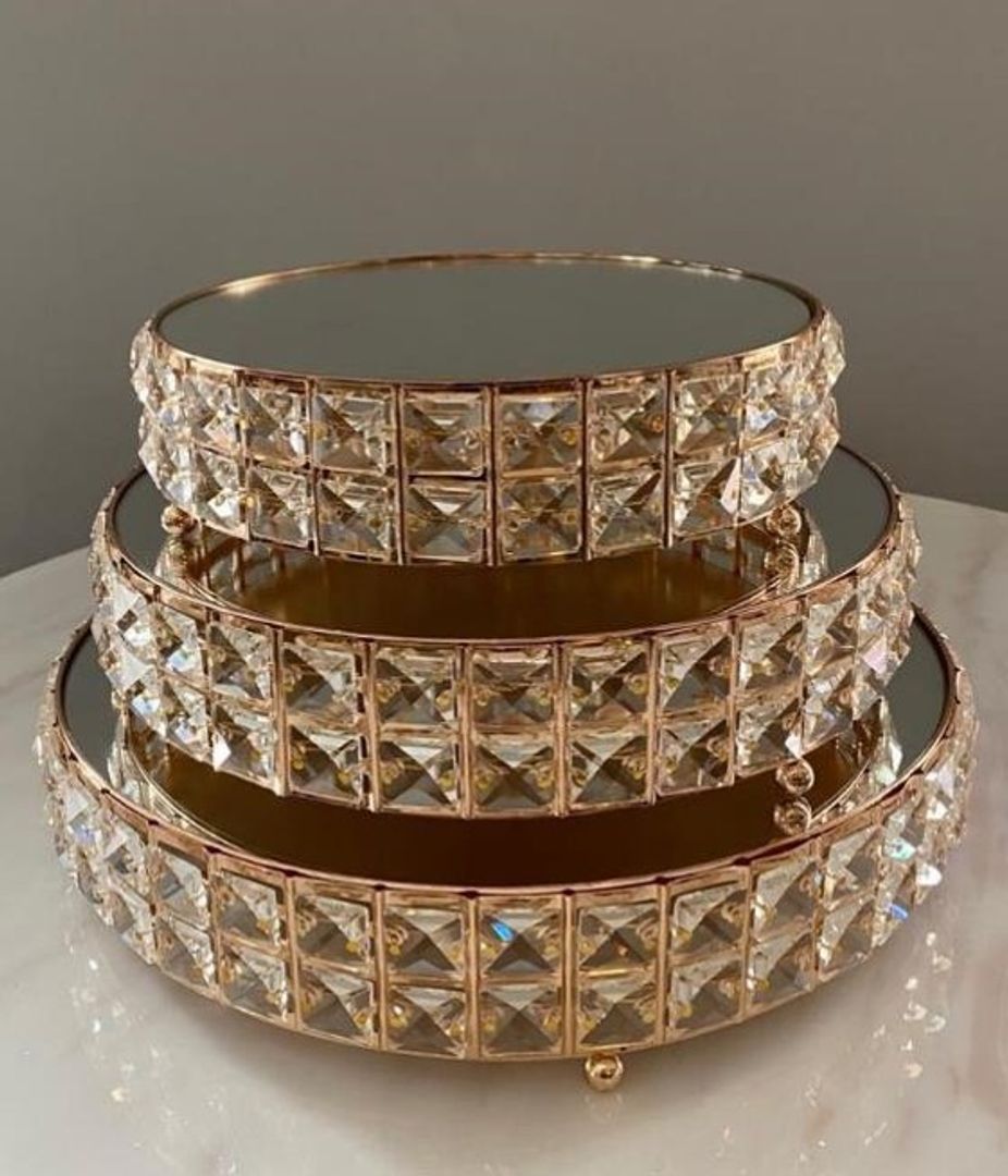 Set de tres bases en metal color dorado con espejo