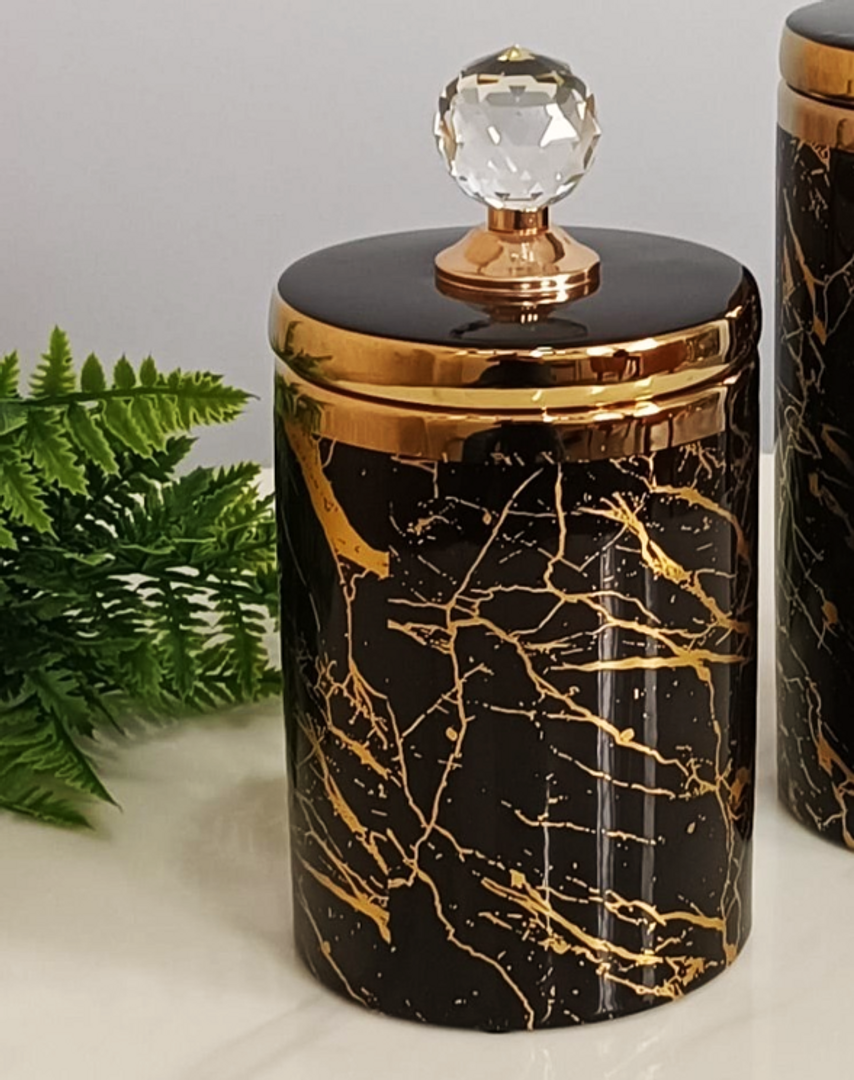 Jarrón de cerámicas en dorado con negro