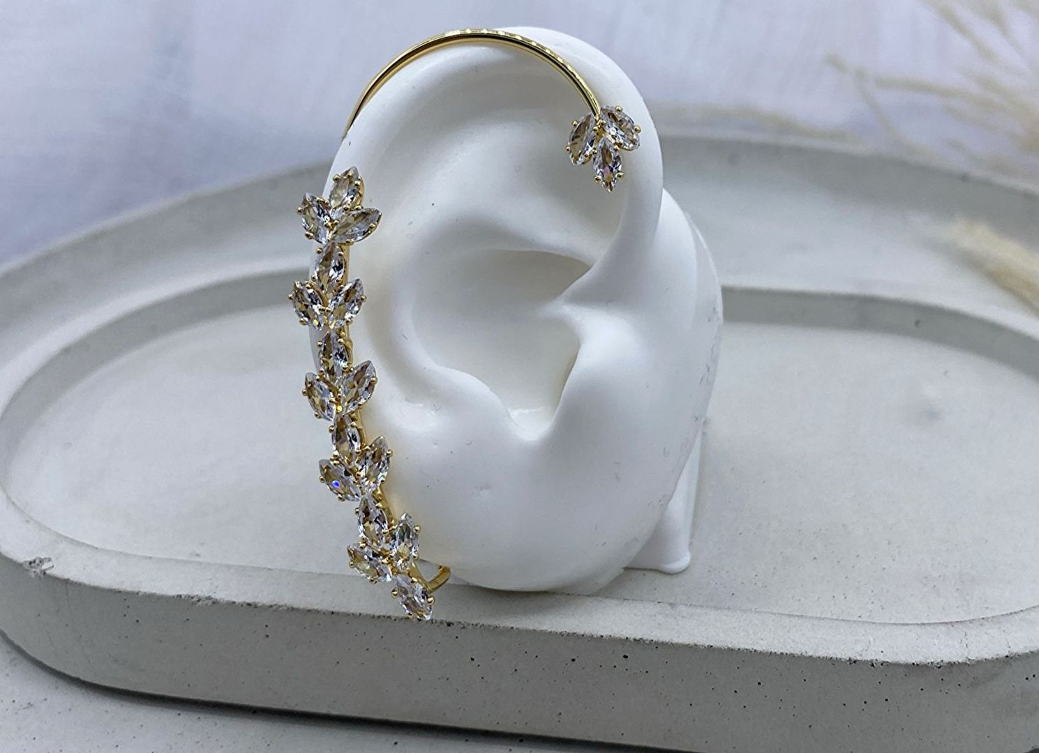 Orejera, dorada, covergold 
