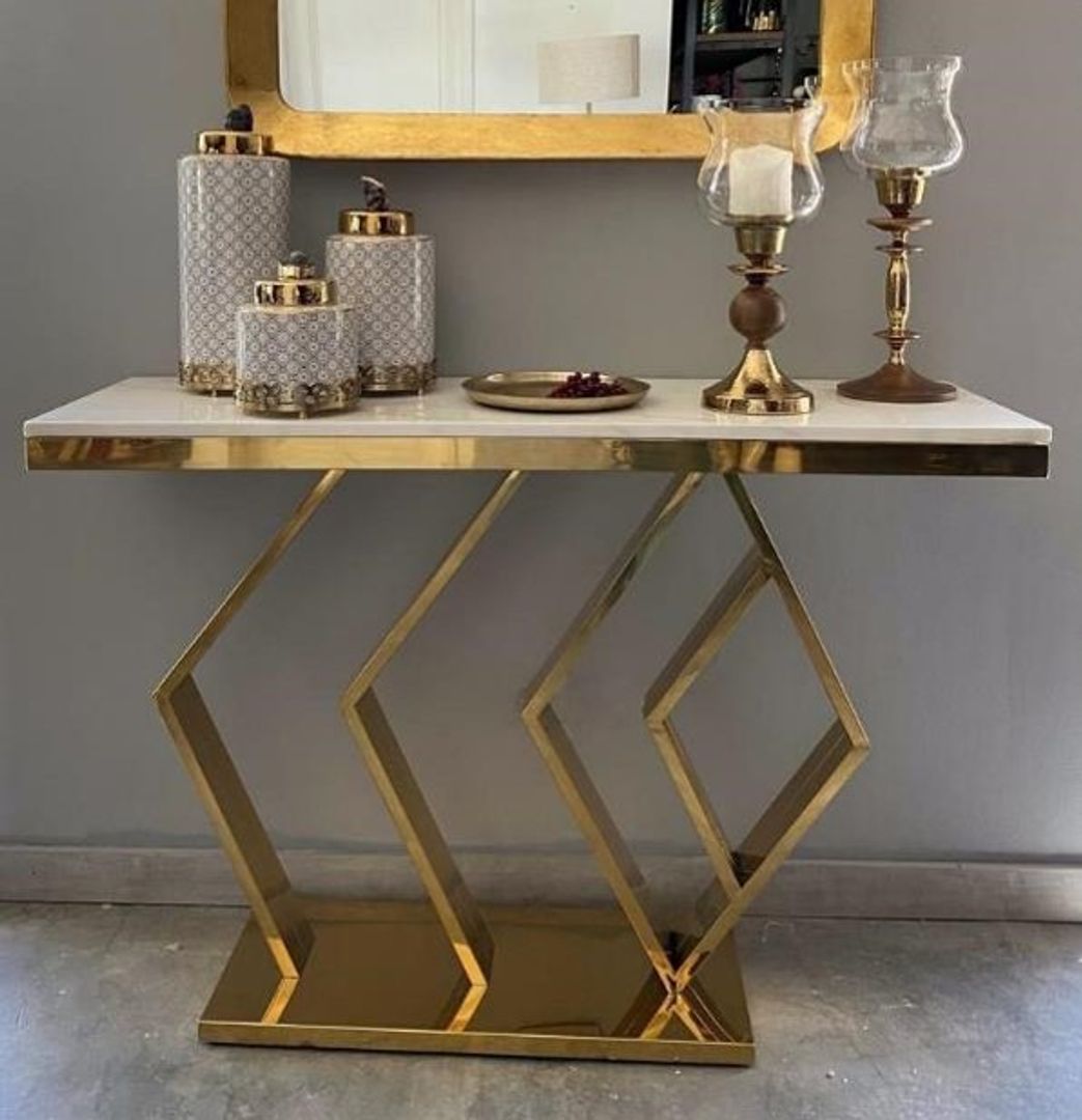 Consola en acero dorado con marmol.