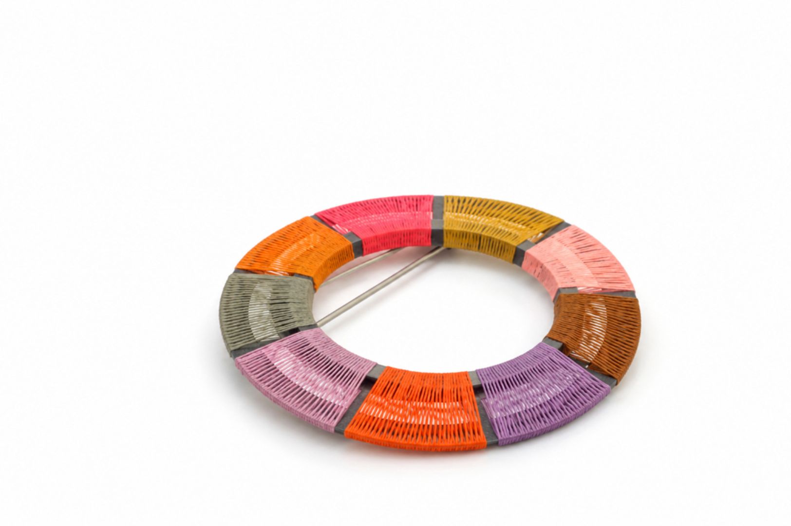 HAND WOVEN CIRCLE BROOCH