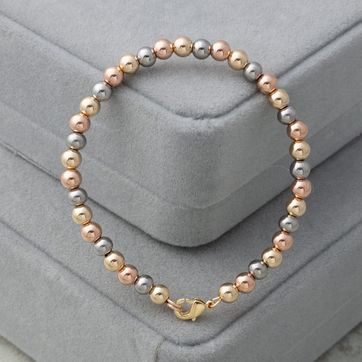 Imagen del producto Pulsera rígida balín 5mm tres oros