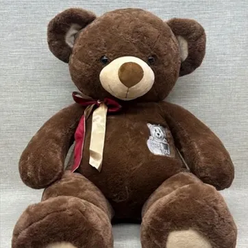 Imagen del producto OSO CON BORDADO Y MOÑO 60 CM